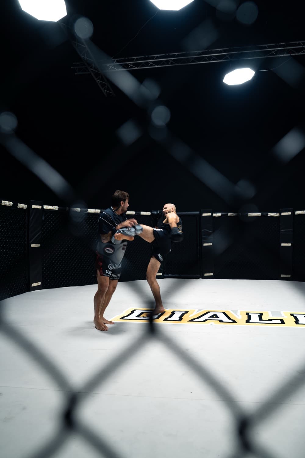 Knee strike thrown during training inside the gym